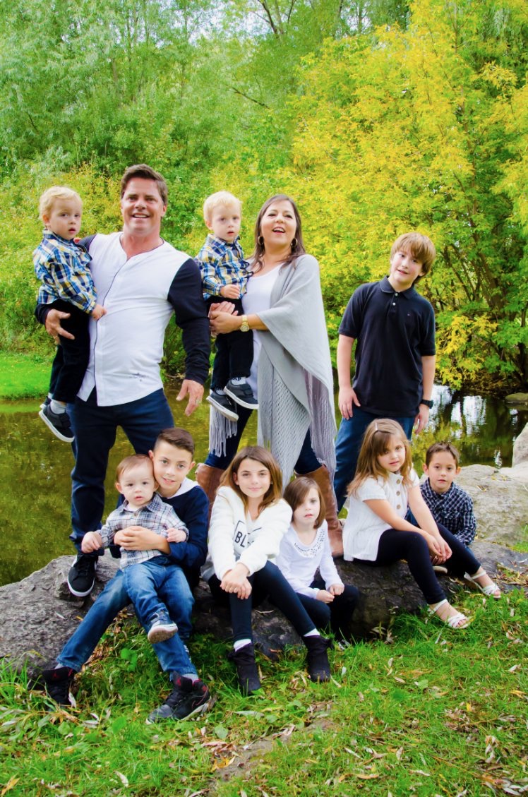 Mark Linton with his family by the water in Hespeler
